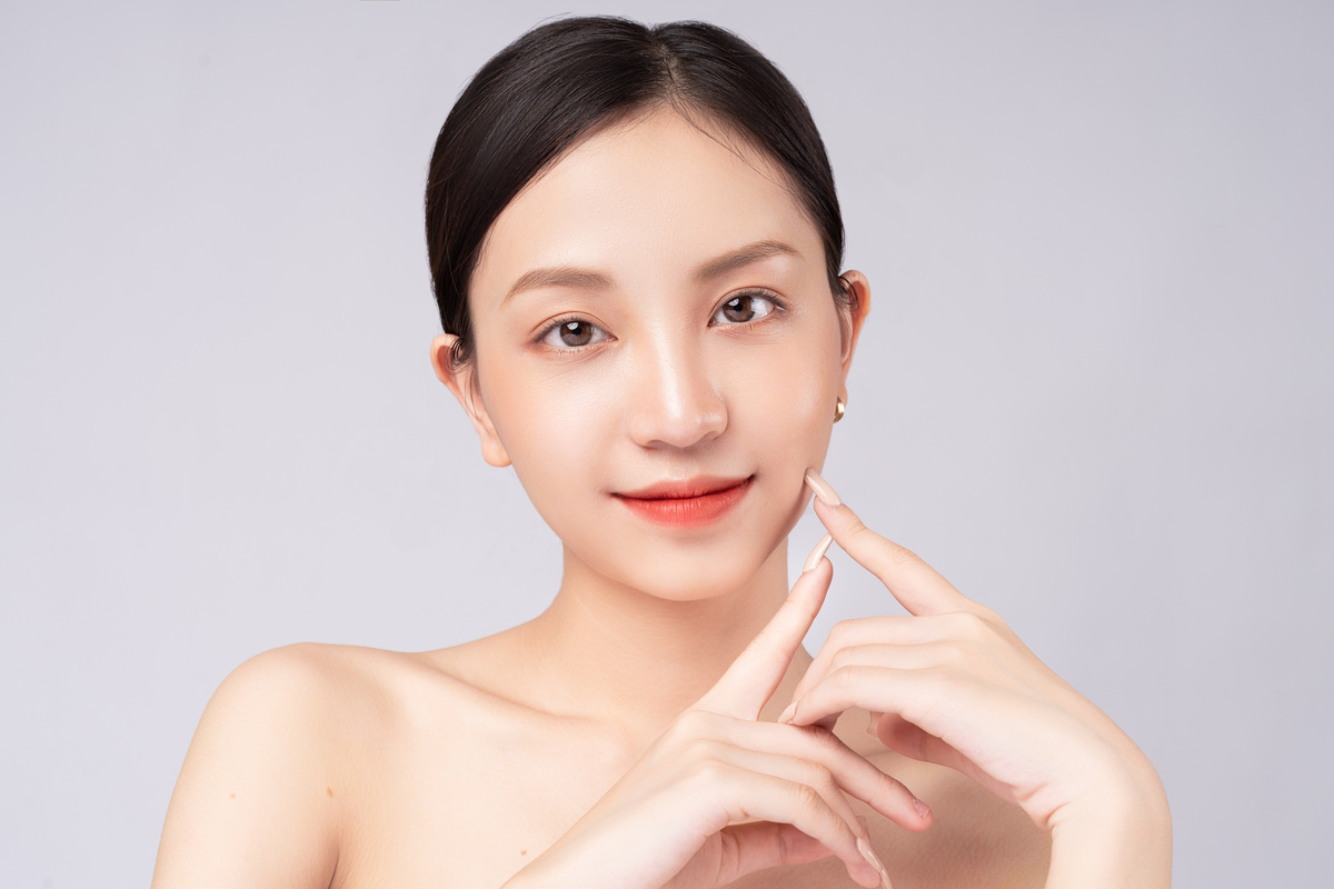 Beautiful Asian Woman Feels Happy with Beautiful Healthy Skin